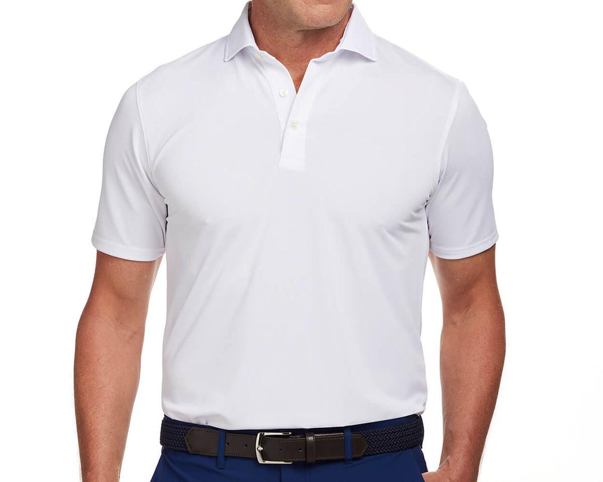 Front shot of Holderness and Bourne white golf polo modeled on man's torso.