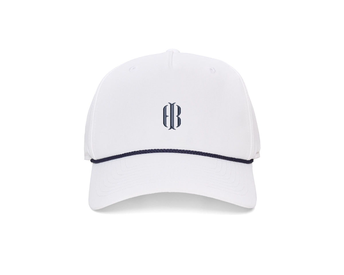 The Performance Rope Hat: White with HB Icon features a six-panel design, navy rope accent, embroidered monogram, UPF 50+ protection, and adjustable snap-back closure.