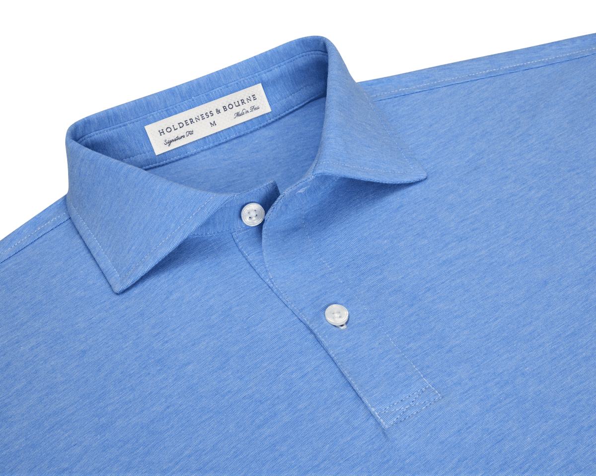 The Hatcher Shirt: Horizon Blue & White, a light-blue polo with a spread collar, two-button placket, and woven label, made from soft Peruvian Pima cotton.