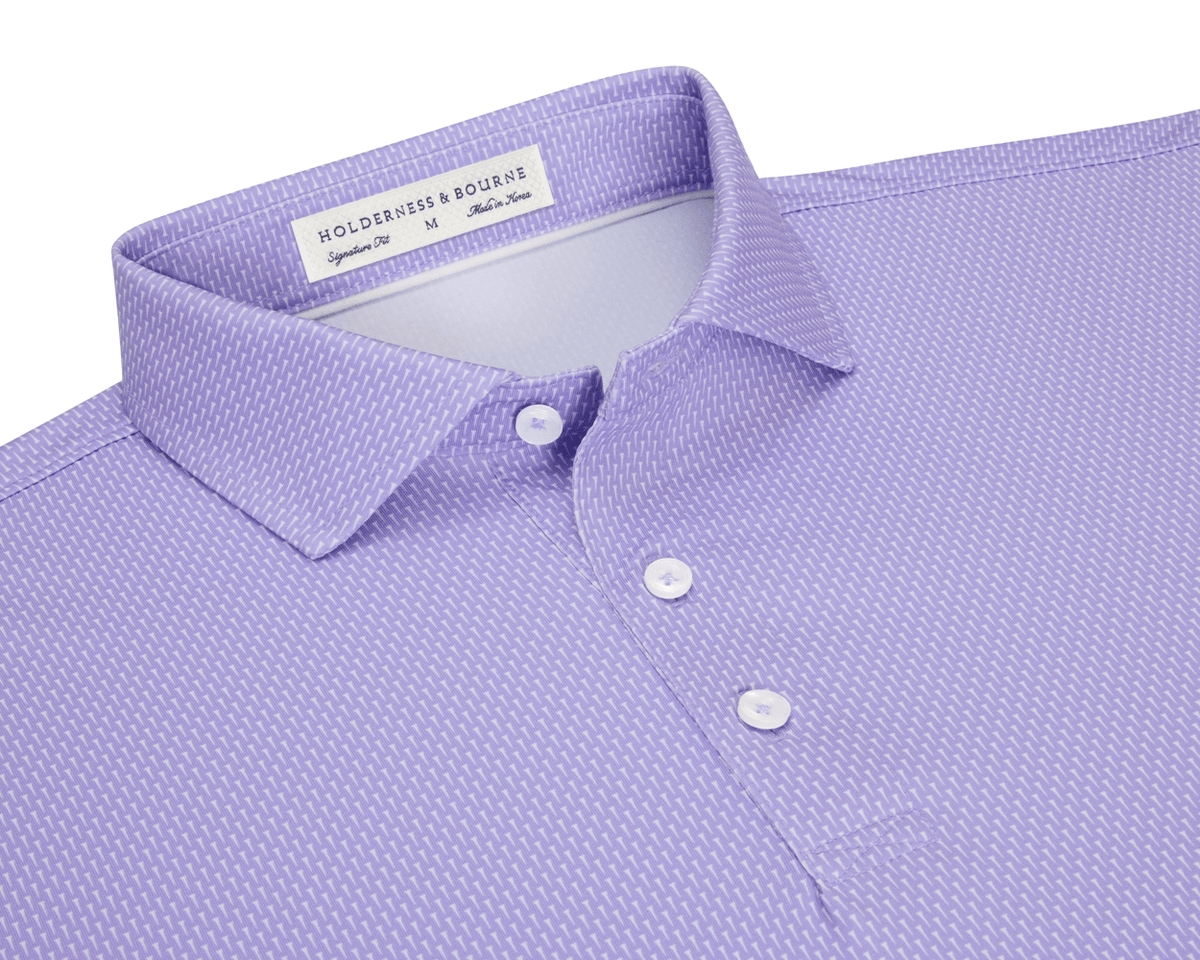 The Hicks Shirt: Tudor features a folded polo with a dash pattern, classic collar, three-button placket, and is crafted from breathable, moisture-wicking performance jersey.