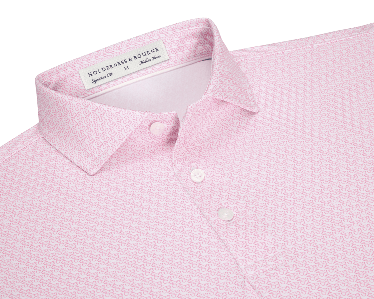The Griffin Shirt: Belmont, a pink polo with a subtle griffin pattern, features a structured collar and button placket, offering style and sun protection.