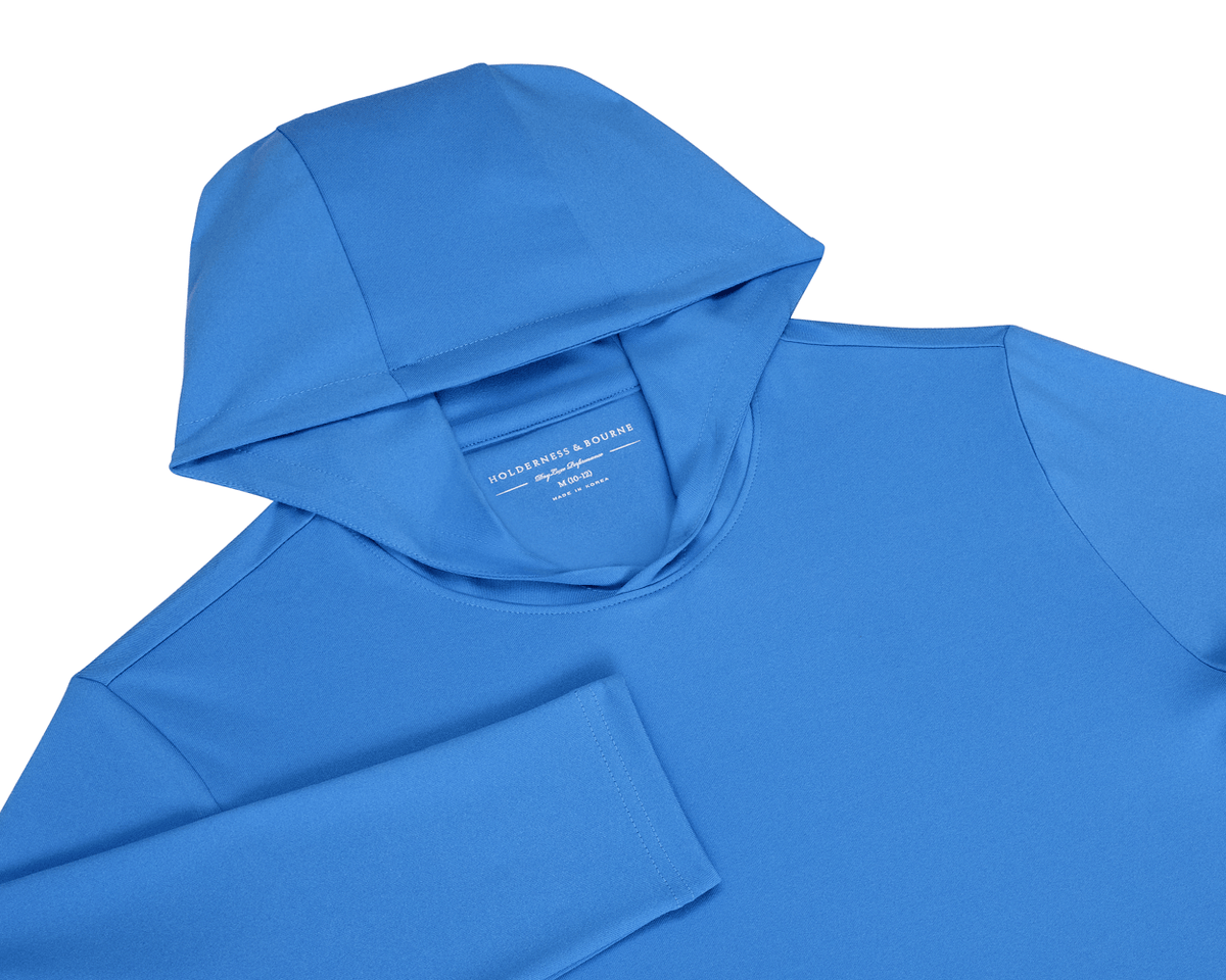 The Jackson Boys Hoodie: Horizon Blue, showcasing a long-sleeve design with a hood, crafted from soft, stretchy fabric for performance, featuring UPF 50+ protection.