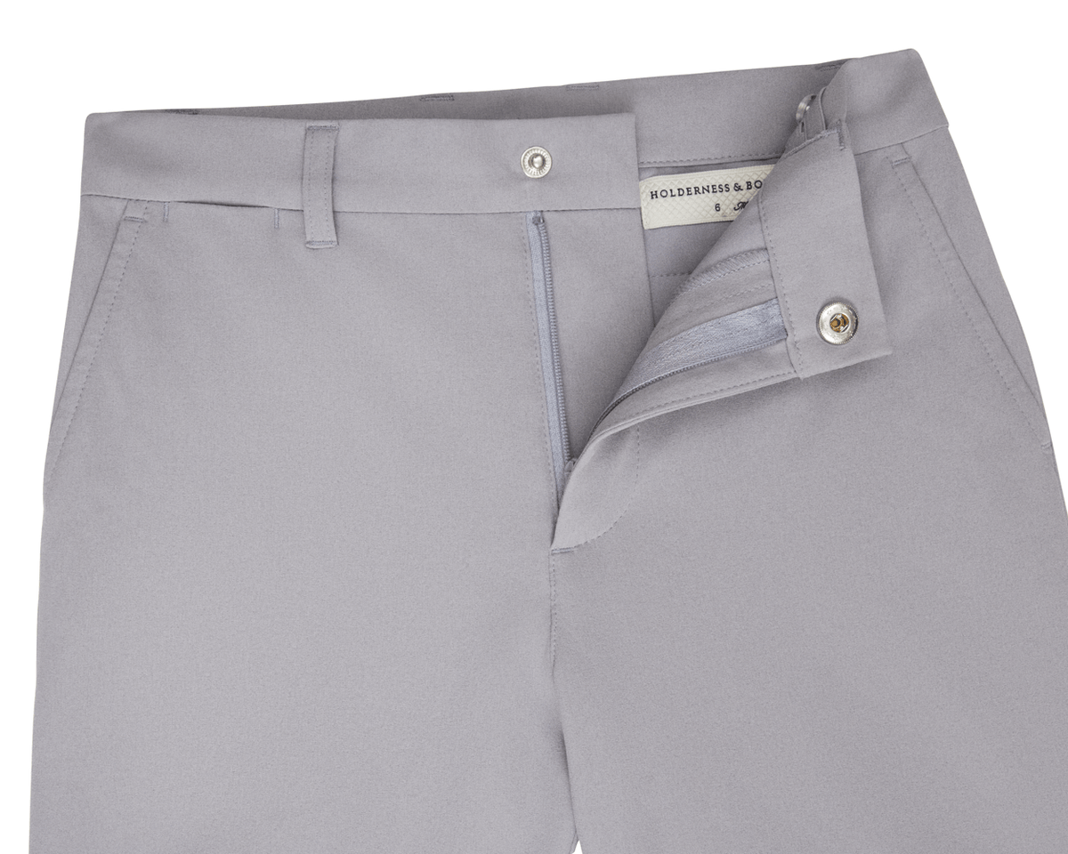 The Harwood Boys Short: Gray, featuring a light gray design with a partially open zipper, a Holderness & Bourne label, and a non-slip waistband.