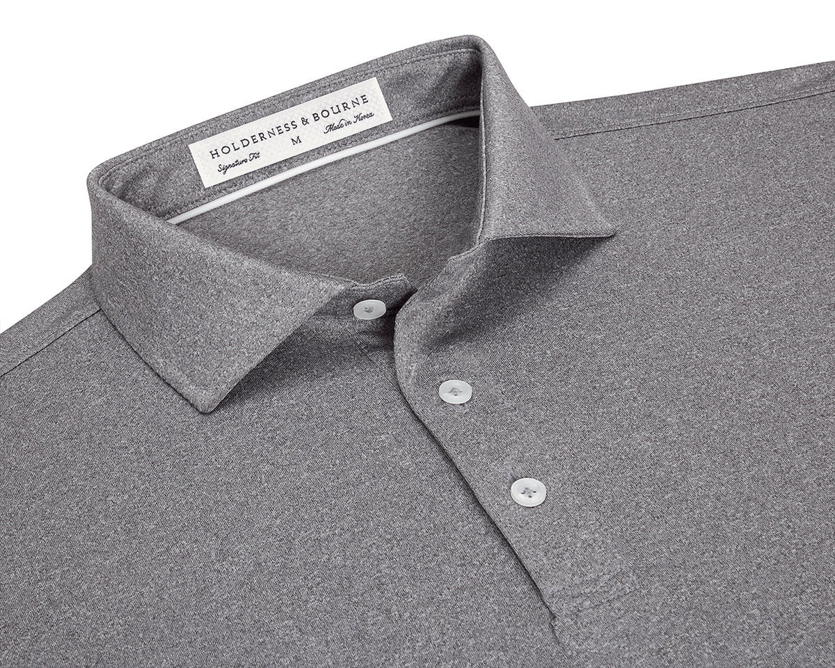 The Anderson Shirt: Heathered Gray features a classic collar, three-button placket, and jersey knit fabric for stretch and moisture-wicking comfort.