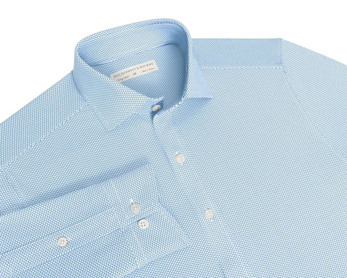 The Goodrich Shirt: Horizon Blue, light-blue button-up with a subtle woven pattern, point collar, white buttons, and breathable Swing Knit® fabric for versatile wear.