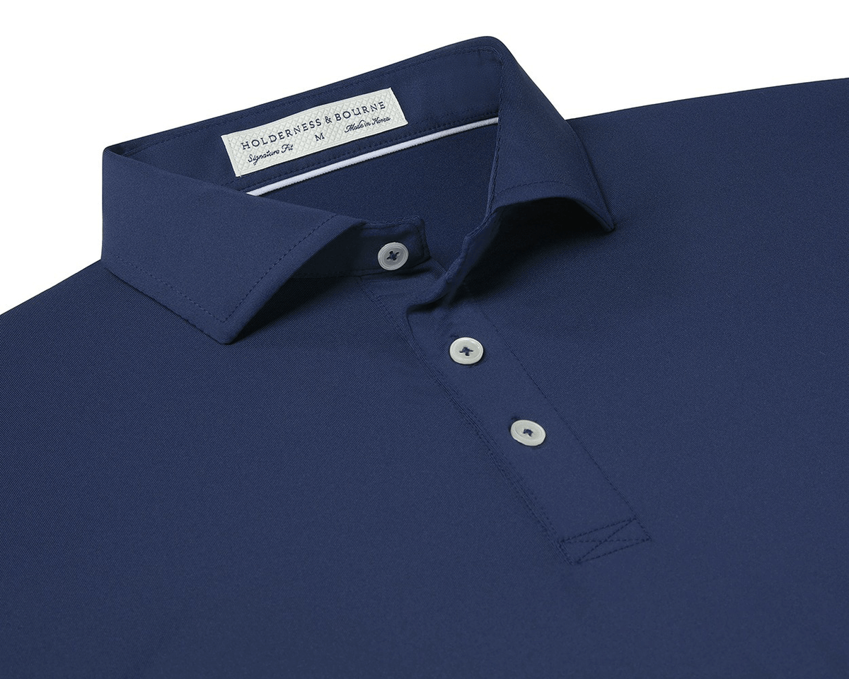 The Anderson Shirt: Navy, showcasing a structured spread collar and three-button placket, crafted for stretch and moisture wicking with Holderness & Bourne's signature fit label.