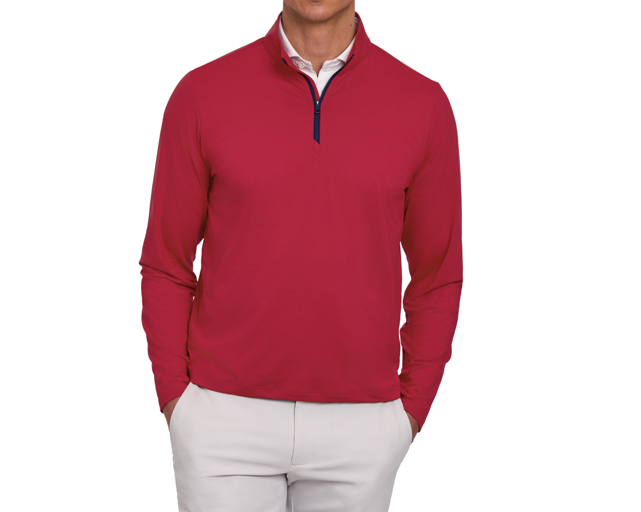 Person wearing The Bell Quarter-Zip: Heathered Liberty Red over a white shirt, paired with light-beige trousers, hands in pockets, showcasing a sporty, sophisticated style.