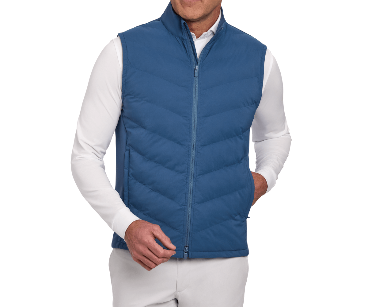 The Benton Vest: Andover, a quilted vest with a high collar and side pockets, features Thermore® insulation and a two-way zipper over a white shirt.