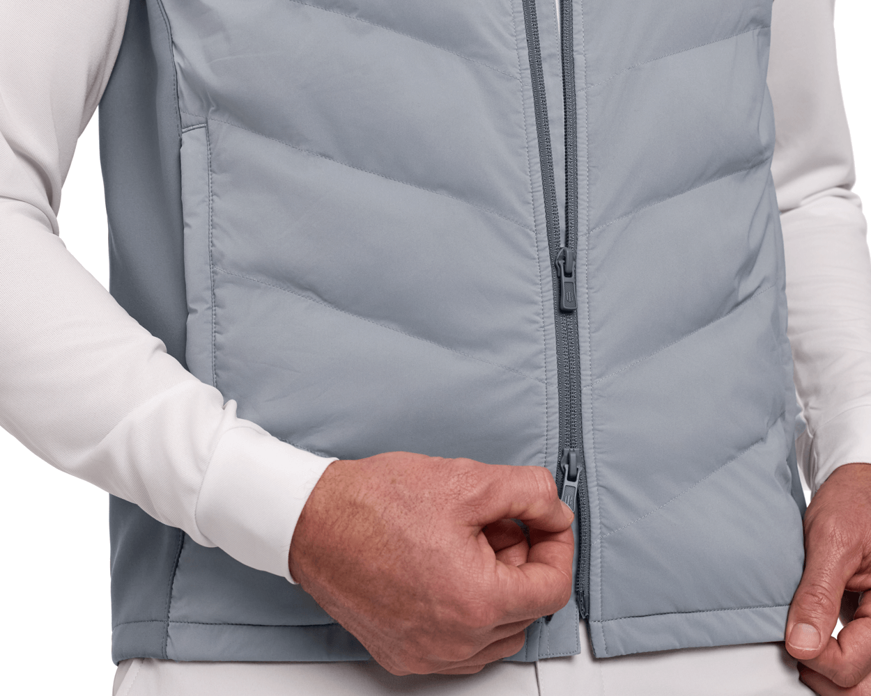 The Benton Vest: Gray, featuring a quilted front with a two-way zipper, shown zipped over a white long-sleeve shirt for comfort and mobility.