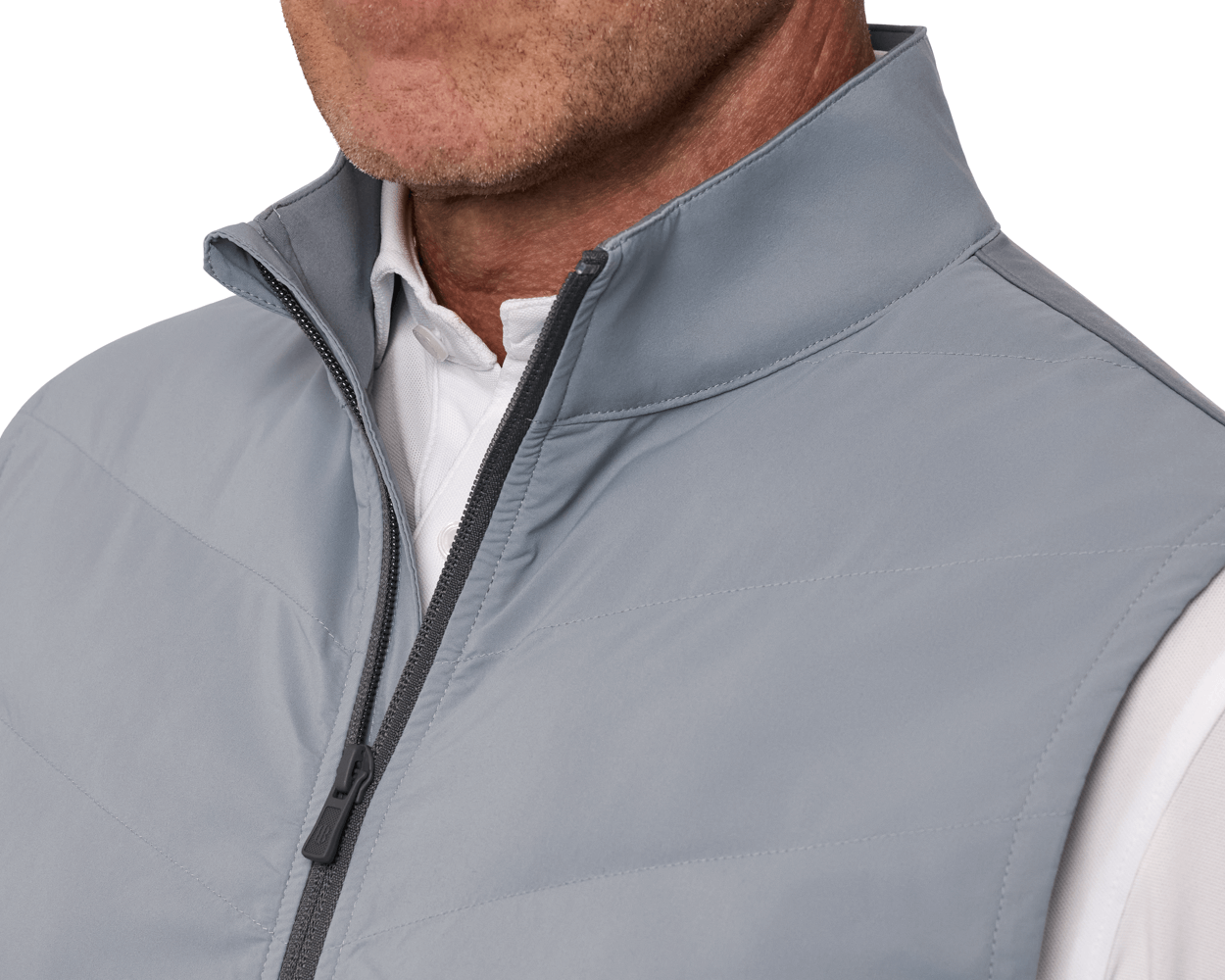 The Benton Vest: Gray, featuring a lightly quilted front with Thermore® insulation and knit back, worn over a white collared shirt.