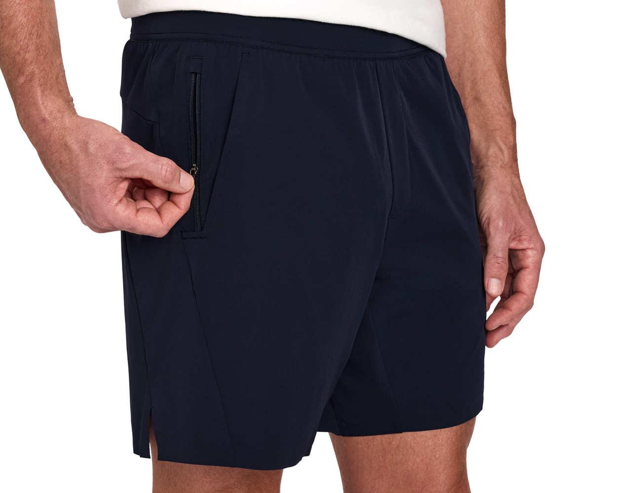The Saunders Short: Navy, featuring a hand unzipping the right side pocket, highlighting the elastic waistband and side slit for comfort and utility.
