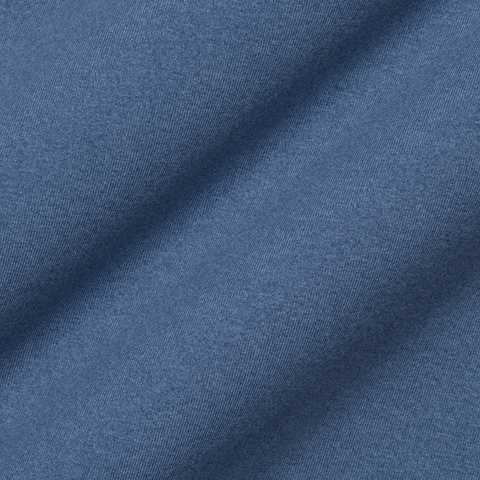 Close-up of The Westland Quarter-Zip: Heathered Pacific Blue fabric showing a fine diagonal twill texture, highlighting its soft peached synthetic blend.