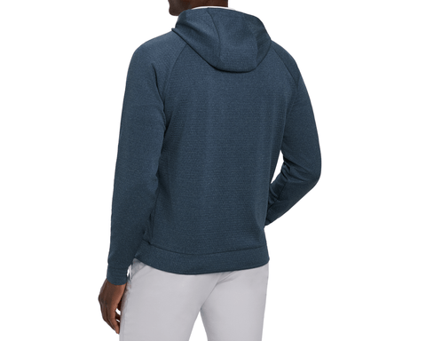 Back view of a male model wearing The Ellison Hoodie: Heathered Pacific Blue, showing the hood, raglan sleeves, banded hem, and light gray pants.