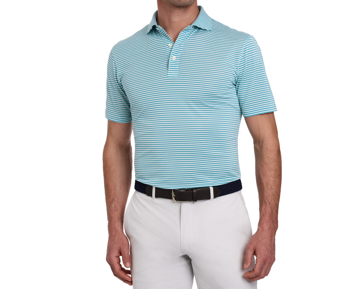 The Maxwell Shirt: Harbor & White, featuring narrow stripes, short sleeves, and a structured collar, paired with light trousers and a dark belt.