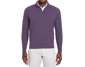 Model wearing The Westland Quarter-Zip: Heathered Amherst, a muted purple pullover with quarter-zip, over a white polo, paired with light-colored trousers.