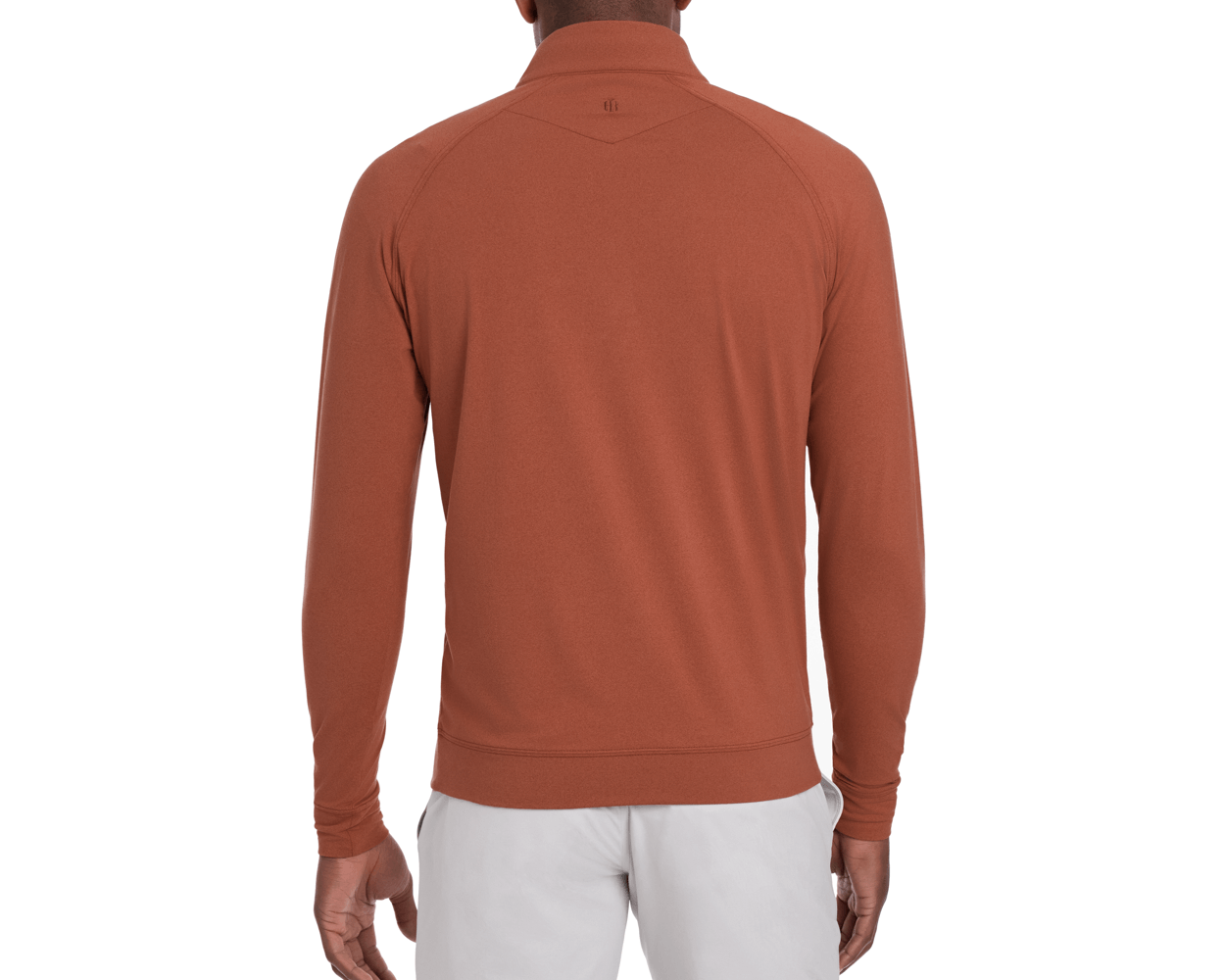 Back view of The Westland Quarter-Zip: Heathered Russet, showcasing its lightweight, moisture-wicking fabric, with gunmetal chrome trim and paired with light-colored pants.