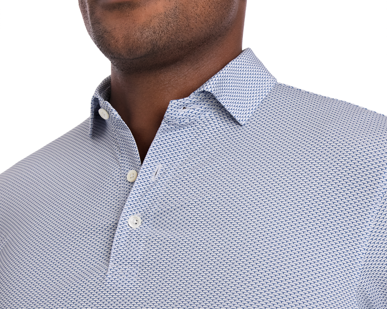 The Armfield Shirt: Andover features a subtle geometric pattern, three-button placket, and classic collar, offering UPF 50+ protection and moisture-wicking performance.