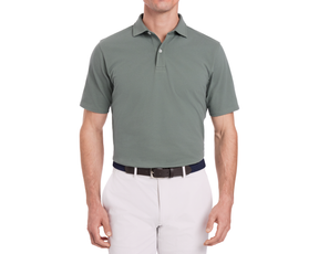The Neville Shirt: Ivy, a short-sleeve collared polo, tucked into light-gray trousers with a two-tone belt, showcasing a relaxed, signature fit.
