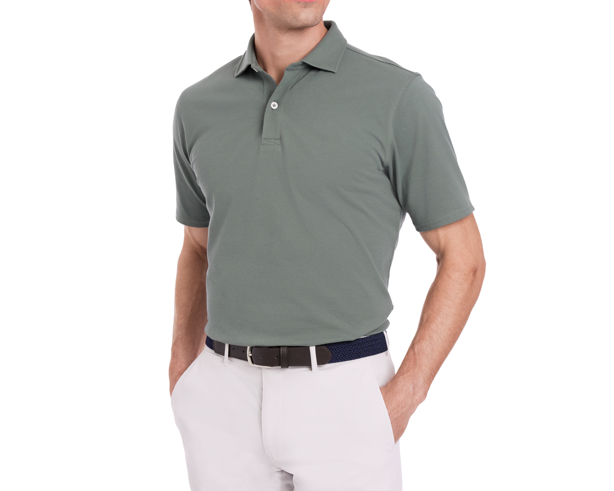 Man wearing The Neville Shirt: Ivy, a short-sleeve polo, tucked into off-white trousers with a navy woven belt, hands in pockets.