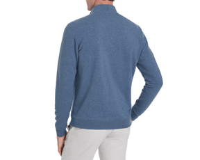Back view of a model wearing The Harper Quarter-Zip: Heathered Bedford, showcasing its mock neck, ribbed cuffs, and soft terry interior.