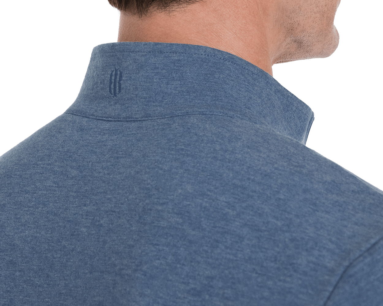 Close-up of a stubbled jaw and neck wearing The Harper Quarter-Zip: Heathered Bedford, showcasing its plush terry interior and distinctive two-line logo under the collar.