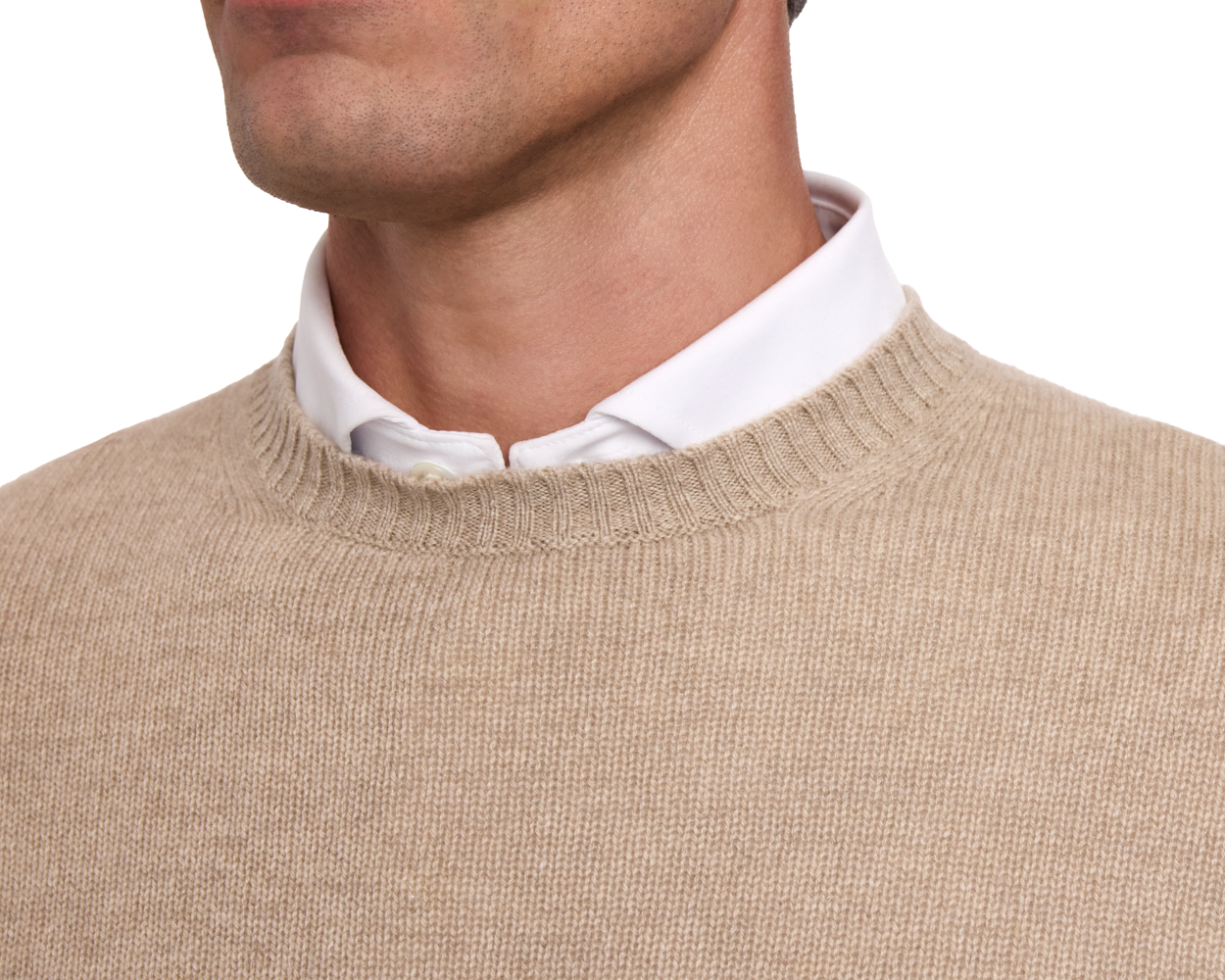 Close-up of a person wearing The Berwick Crewneck Sweater: Heathered Dune, showcasing its plush Scottish cashmere and classic crewneck design over a white shirt.