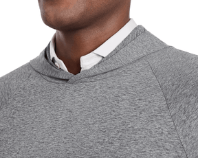 The Dunbar Hoodie: Heathered Charcoal, featuring a light gray heathered pullover with visible white collared shirt underneath, known for advanced breathability and UPF 50+ protection.