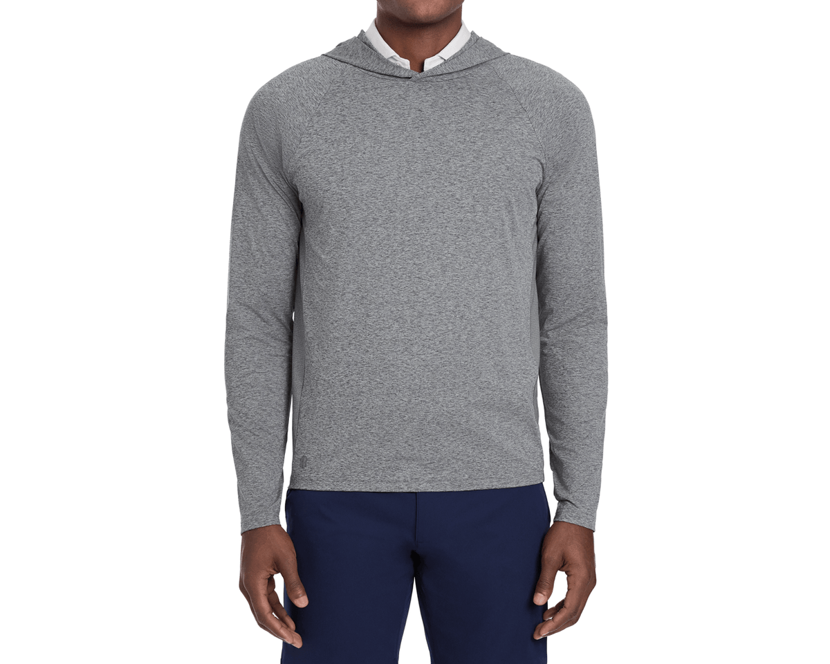 The Dunbar Hoodie: Heathered Charcoal, featuring a light-heather gray performance design with a hood, worn over a white collared shirt, paired with dark navy-blue pants.