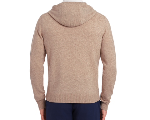 The Logan Hoodie Sweater: Heathered Dune, showcasing a back view with ribbed cuffs and hem, hood resting flat, paired with navy pants.