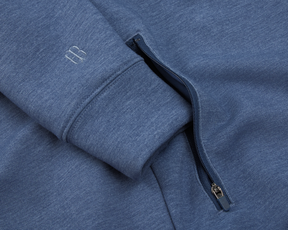The Tilley Quarter-Zip Hoodie: Heathered Andover features a ribbed cuff with logo, zippered pocket, and sleek silhouette in soft synthetic fabric.
