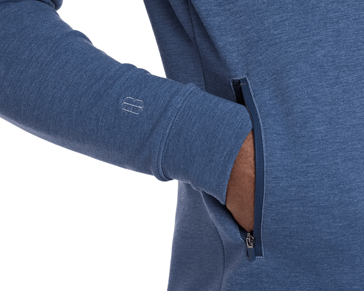 The Tilley Quarter-Zip Hoodie: Heathered Andover features a zippered side pocket and embroidered cuff logo, showcasing its sleek, versatile design for cool-weather activities.