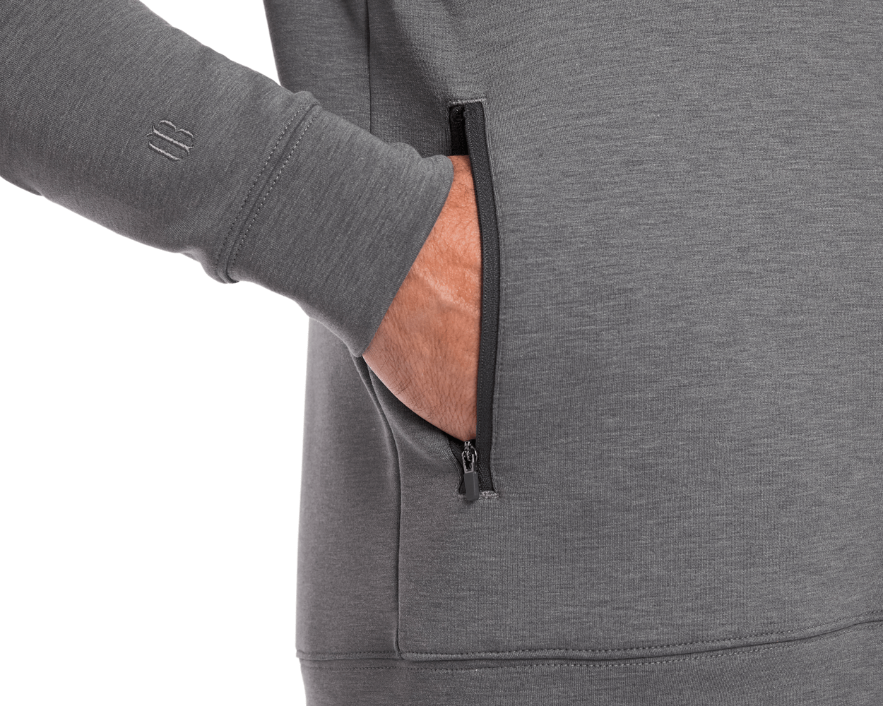 Person wearing The Tilley Quarter-Zip Hoodie: Heathered Charcoal, showcasing a sleek silhouette with a small zippered side pocket, ideal for versatile, cool-weather wear.