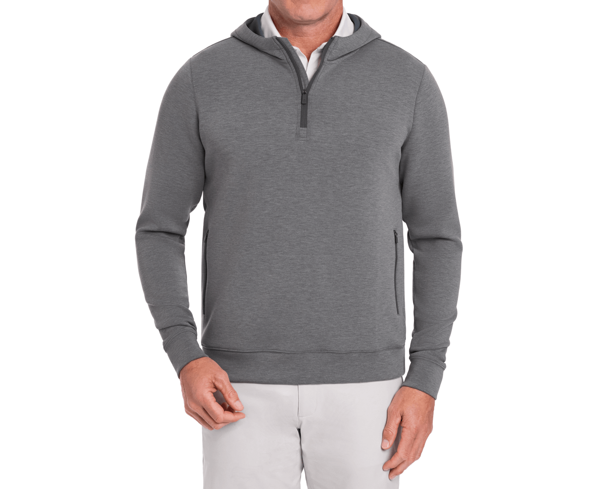 The Tilley Quarter-Zip Hoodie: Heathered Charcoal, featuring a sleek silhouette with a quarter-length zipper, zippered side pockets, paired with a white shirt and light trousers.