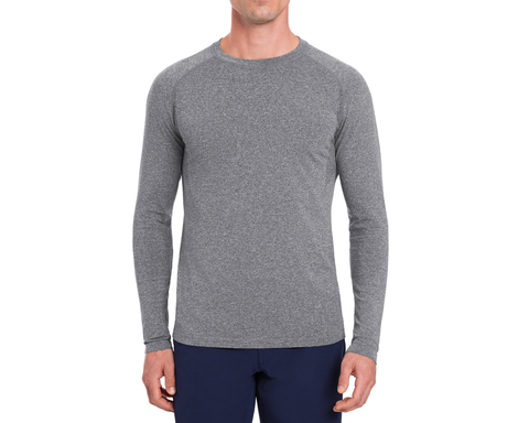 The Carr T-Shirt: Heathered Gray, shown on a person, features long sleeves and a form-fitting design, ideal for active and casual wear.
