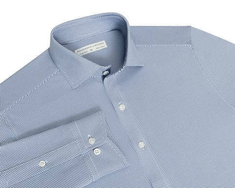 Flat-lay of The Goodrich Shirt: Pacific Blue showing the spread collar, button placket, buttoned cuffs, and fine blue and white geometric print.