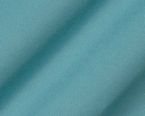 The Anderson Shirt: Harbor in teal features a close-up of fine diagonal ribbing with gentle fabric folds, highlighting its jersey knit for comfort and stretch.