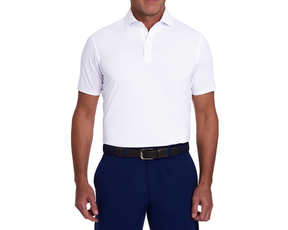 The Anderson Shirt: White polo with short sleeves, tucked into navy trousers, featuring a black braided belt. Offers stretch, moisture wicking, and soft jersey knit fabric.