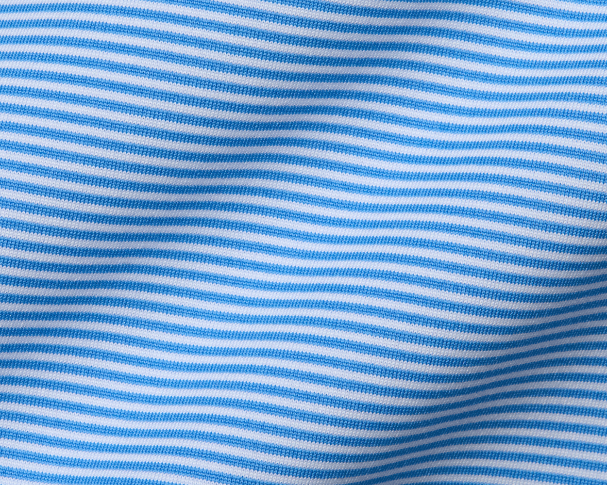 The Perkins Shirt: Horizon Blue & White features fine knit fabric with blue and white stripes, offering four-way stretch and moisture-wicking performance.