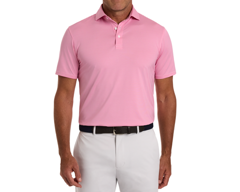 The Perkins Shirt: Belmont & White, showcasing a light-pink polo with fine stripes, tucked into light-gray trousers, features moisture-wicking fabric and UPF 50+ protection.