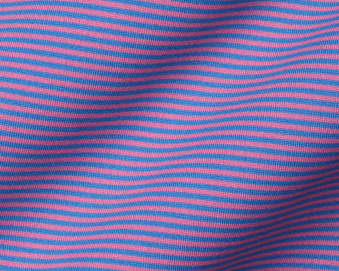 Close-up of The Perkins Boys Shirt: Horizon Blue & Belmont, showcasing its pink and blue striped knit fabric, hinting at its breathable, stretchy DryLuxe material.