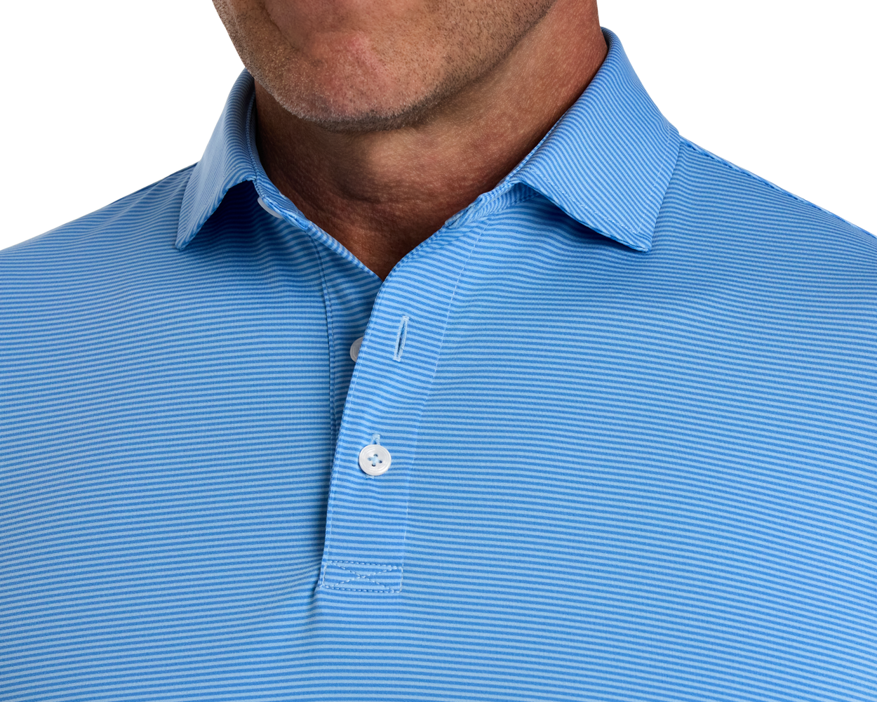 Close-up of The Perkins Shirt: Horizon Blue & Vista Blue, showcasing its light-blue, fine-striped fabric, classic button-up collar, and part of a man’s stubbled jawline.