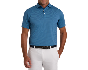 Man wearing The Perkins Shirt: Maidstone Blue & Harbor, a short-sleeve polo with fine stripes, paired with white trousers and a woven belt.