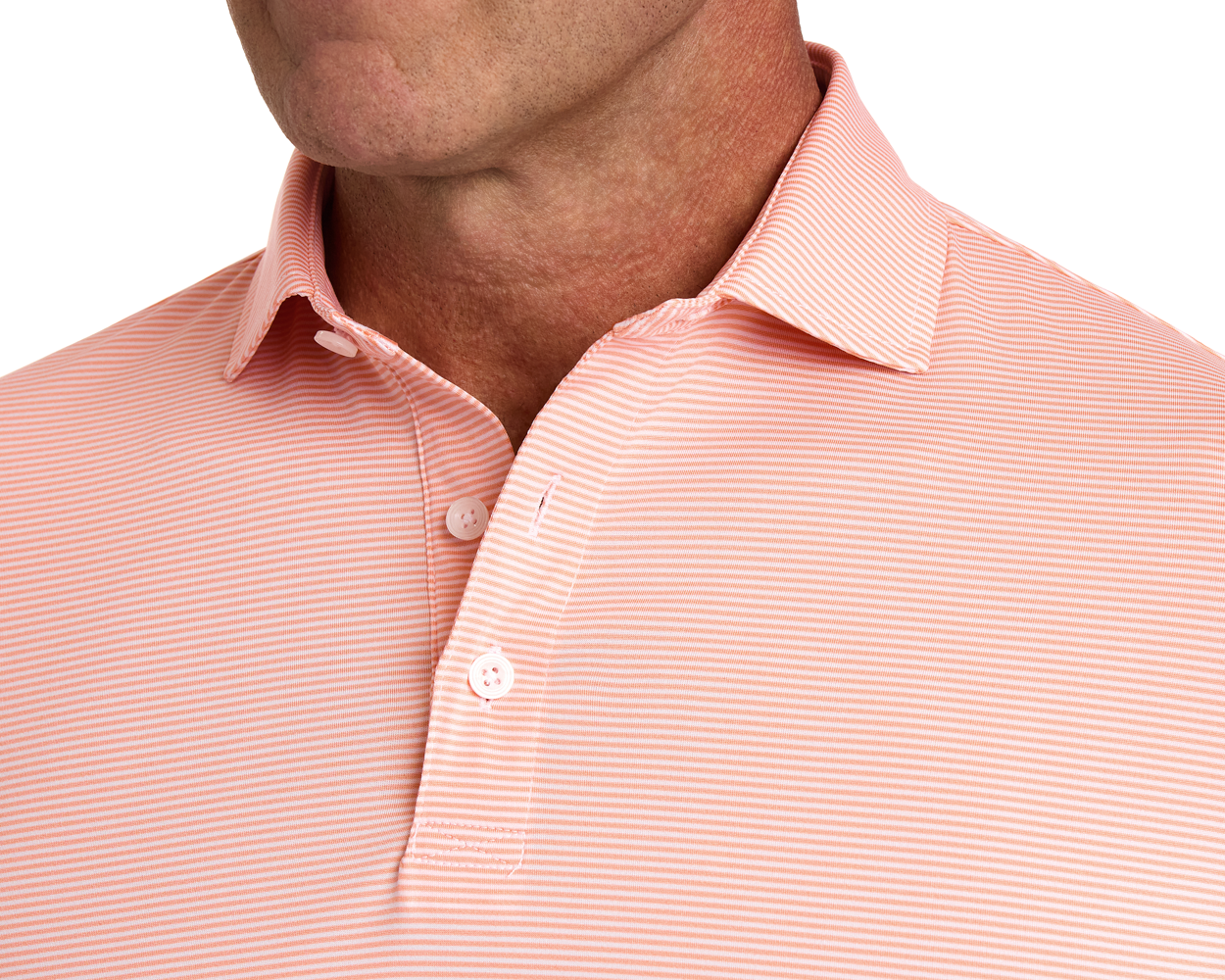 The Perkins Shirt: Nectarine & White, showcasing a salmon-pink polo with white stripes, structured collar, button detail, and soft, stretchy fabric for comfort and style.