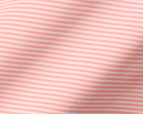 Close-up of The Perkins Shirt: Nectarine & White, featuring a soft knit fabric with fine horizontal stripes, showcasing its lightweight and moisture-wicking performance.