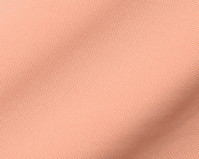 Close-up of The Macdonald Shirt: Nectarine, highlighting its soft piqué fabric with a tiny mesh pattern, showcasing breathable, lightweight texture for warm weather comfort.