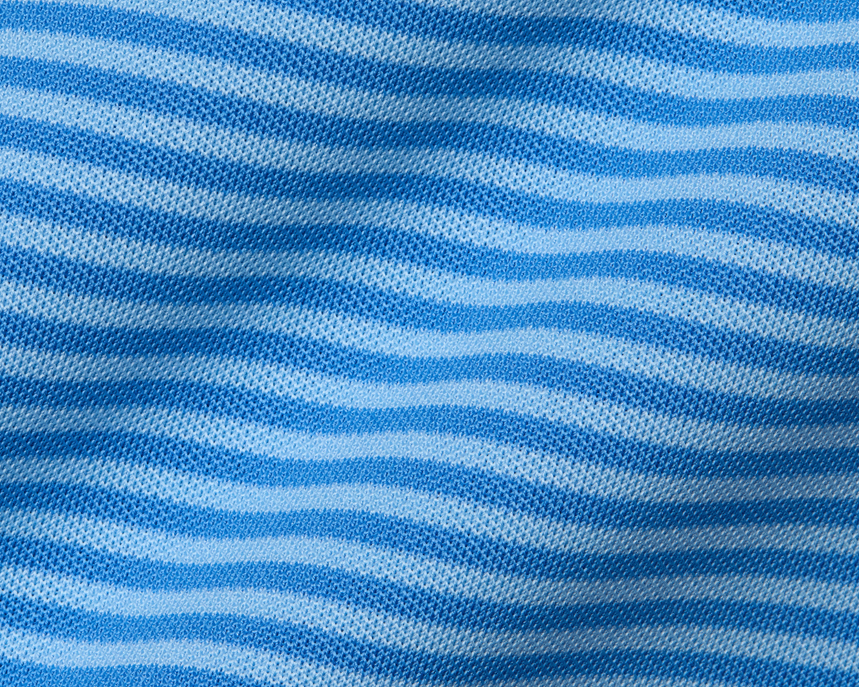 The Maxwell Shirt: Horizon Blue & Vista Blue features a textured knit with light-blue and white stripes, highlighting a modern, breathable, and moisture-wicking design.