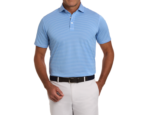 The Maxwell Shirt: Horizon Blue & White, features thin stripes, short sleeves, a structured collar, and a comfortable fit, paired with off-white trousers and a dark belt.