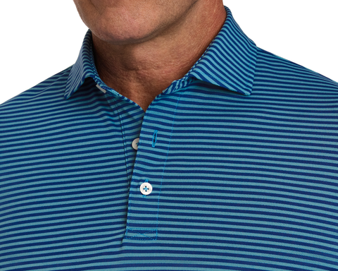 The Maxwell Shirt: Maidstone Blue & Harbor, featuring narrow blue stripes, a collared design, and two white buttons, crafted from stretchy performance pique for comfort.