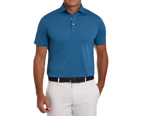 Man wearing The Maxwell Shirt: Maidstone Blue & Harbor, a striped performance polo with a structured collar, tucked into light trousers with a belt.