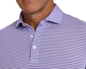 The Maxwell Shirt: Tudor & White, featuring a lavender-striped pattern, structured collar, and white buttons, crafted from breathable, moisture-wicking pique fabric for comfort.